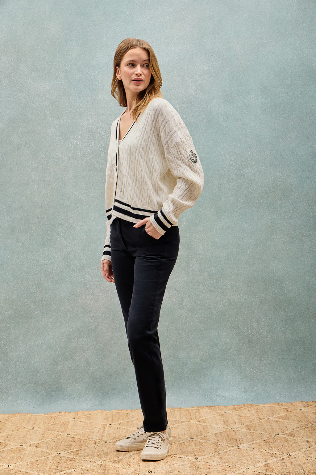 Beige cable-knit short cardigan with buttons and nautical patch - Image 11