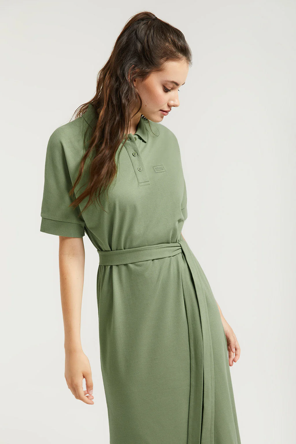 Green dolman-sleeve dress with embroidery in matching colour
