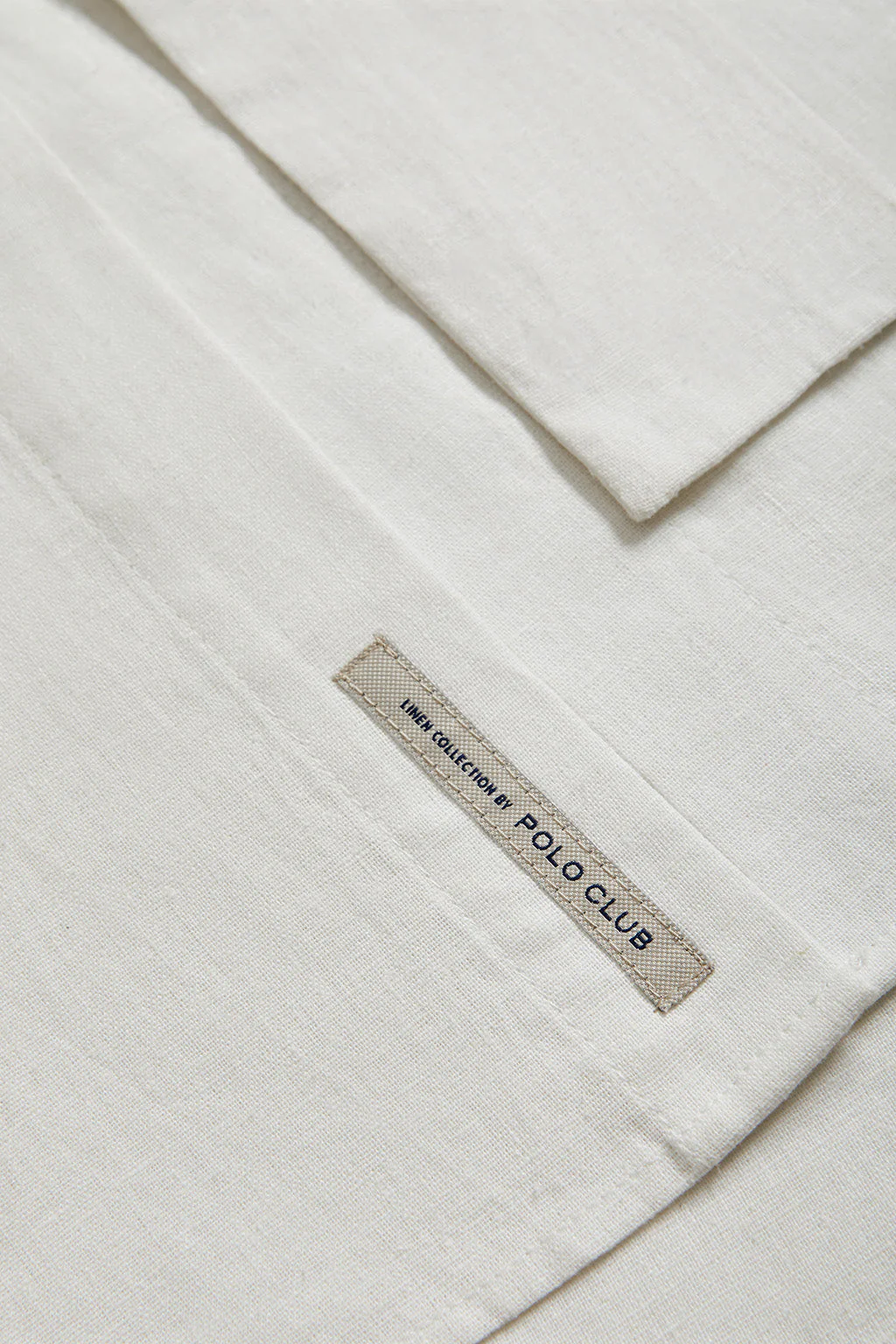 White linen midi dress with Rigby Go embroidered detail - Image 11