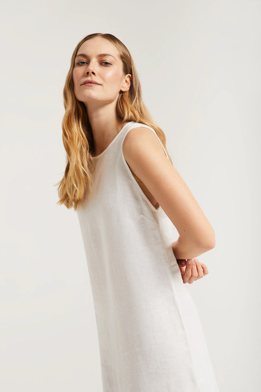 White sleeveless linen dress with Rigby Go logo
