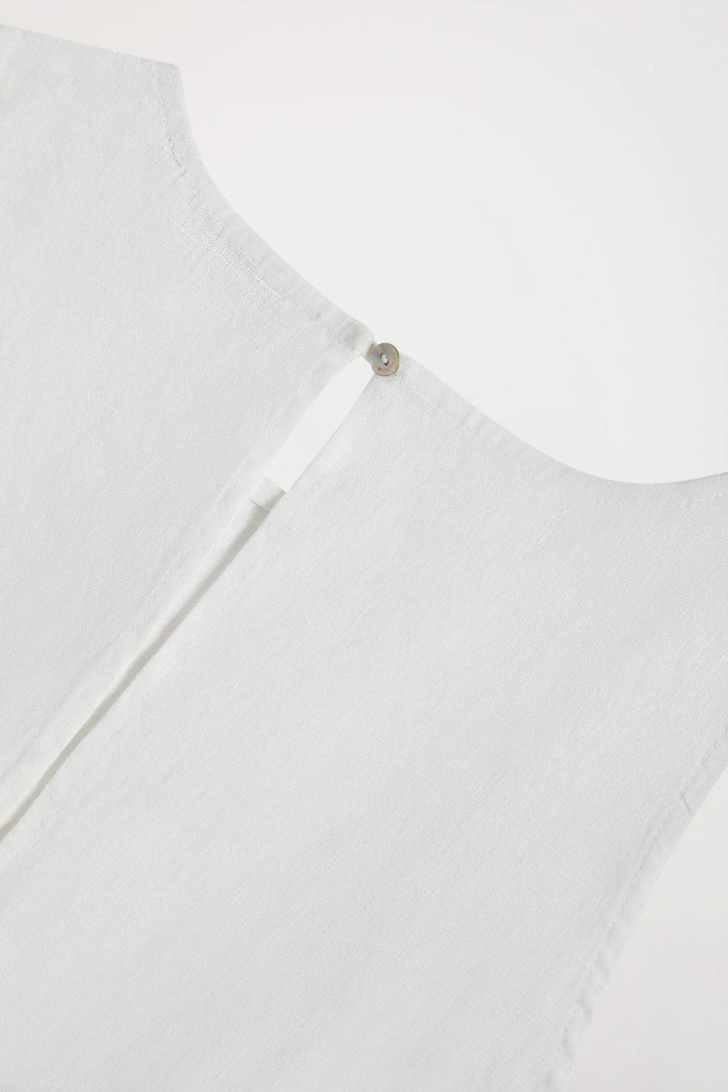 White sleeveless linen dress with Rigby Go logo - Image 9