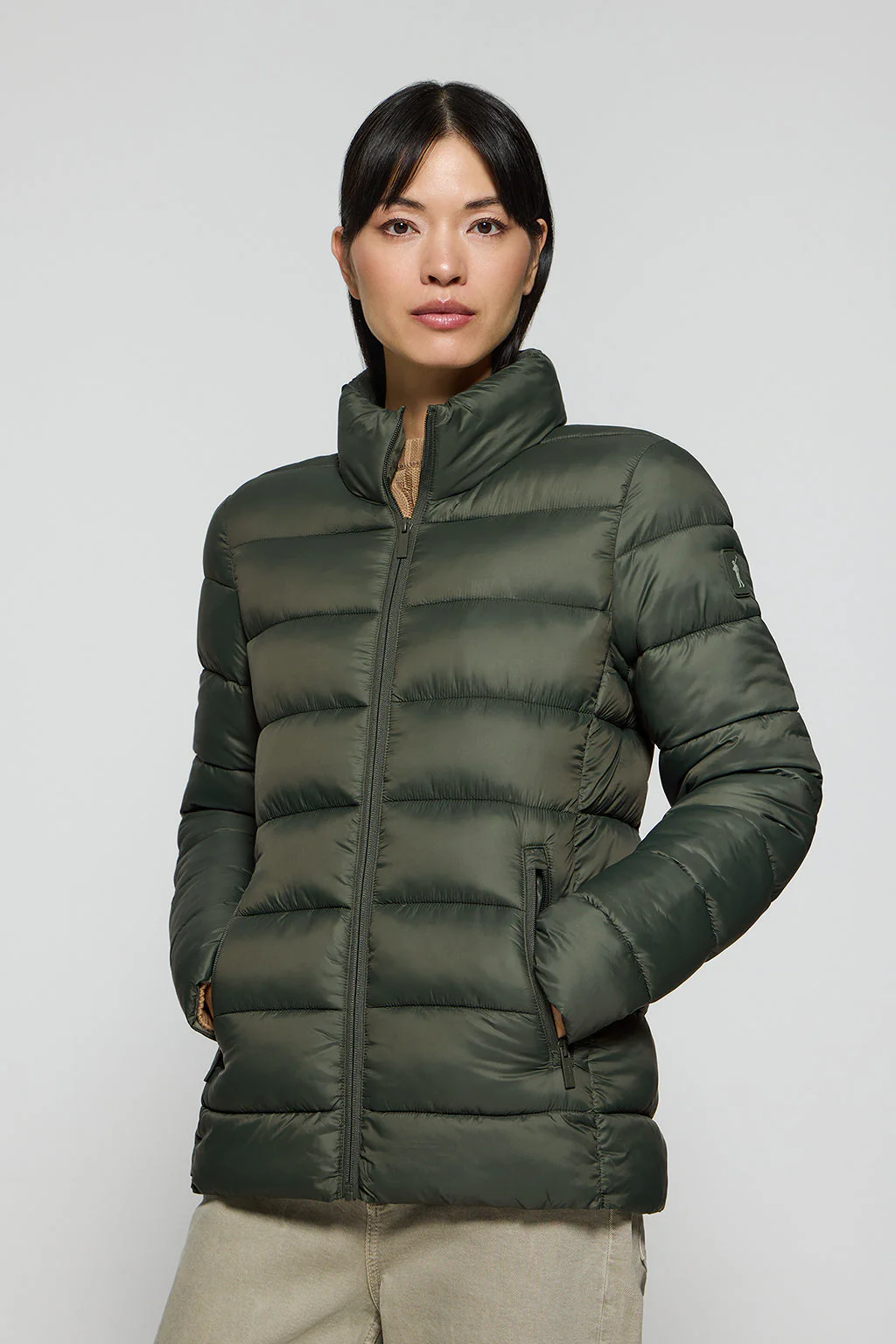 Green ultralight jacket Susanne with Rigby Go patch