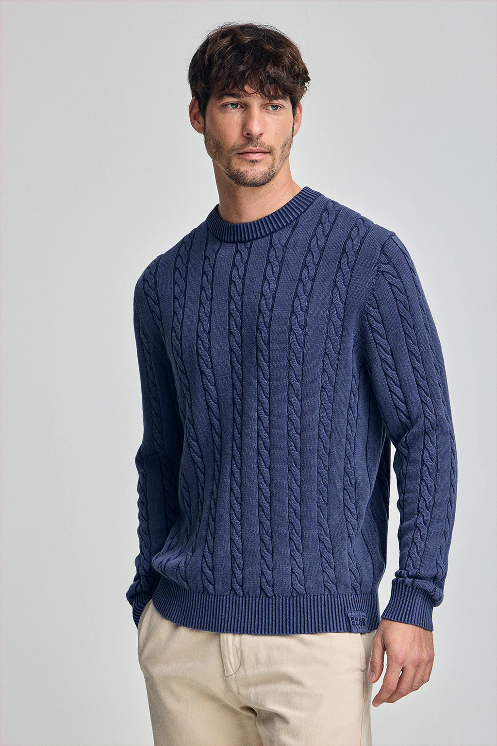 Blue-violet garment-dye cable-knit jumper with embroidered logo