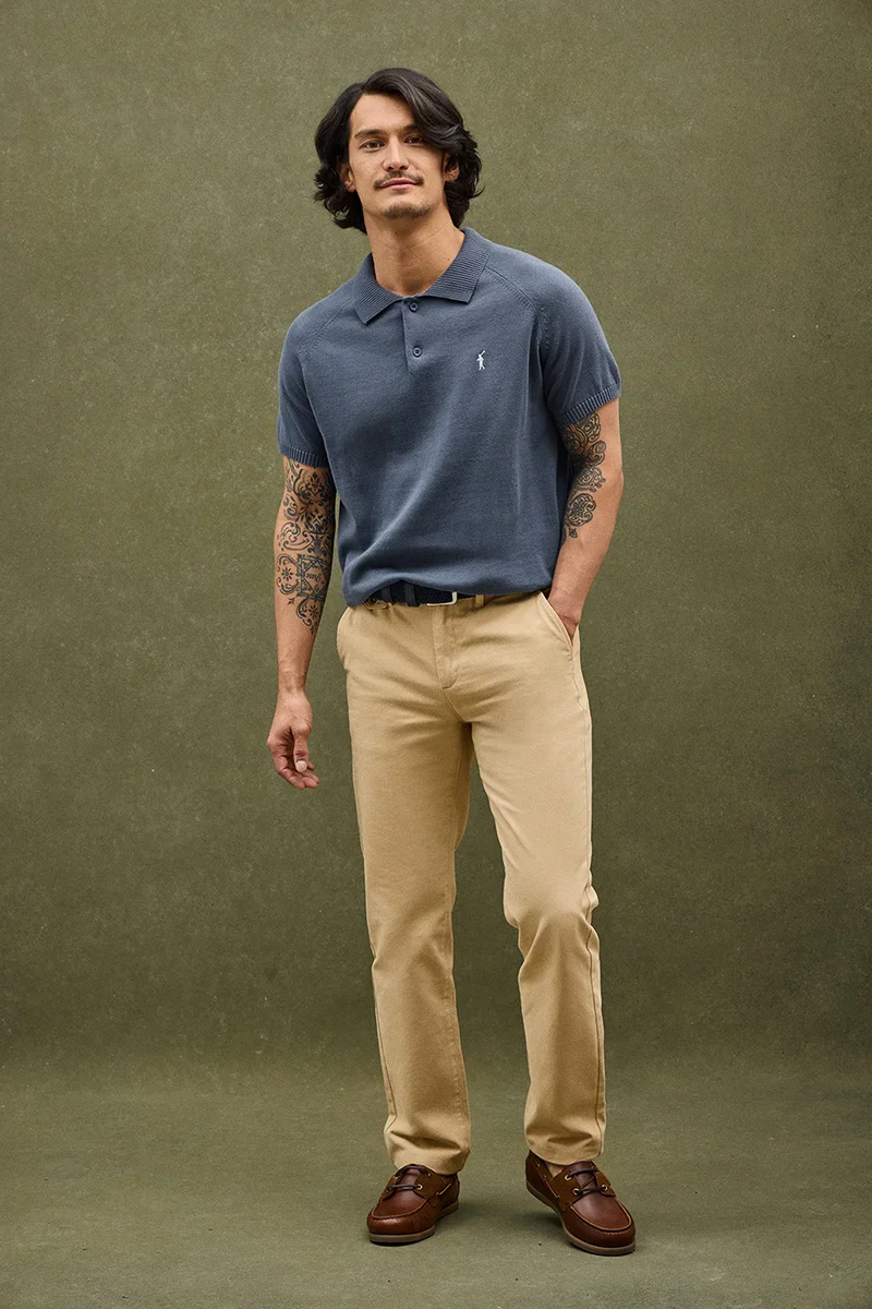 Denim-blue short-sleeve jumper with polo collar and Rigby Go logo