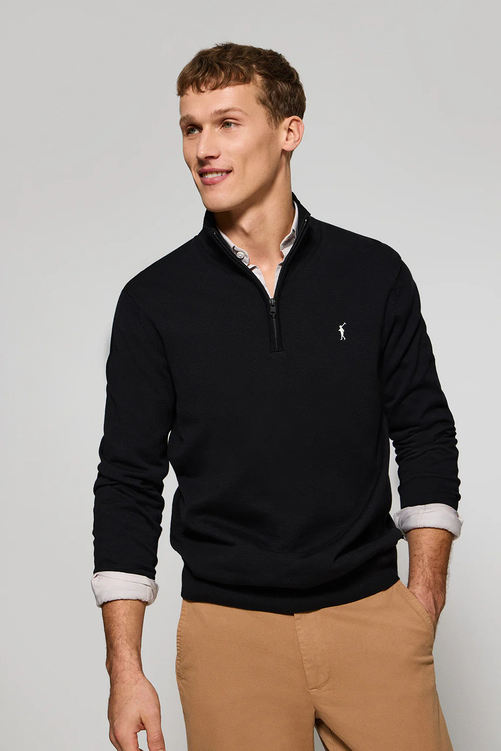 Black knit jumper with zip and Rigby Go embroidered logo