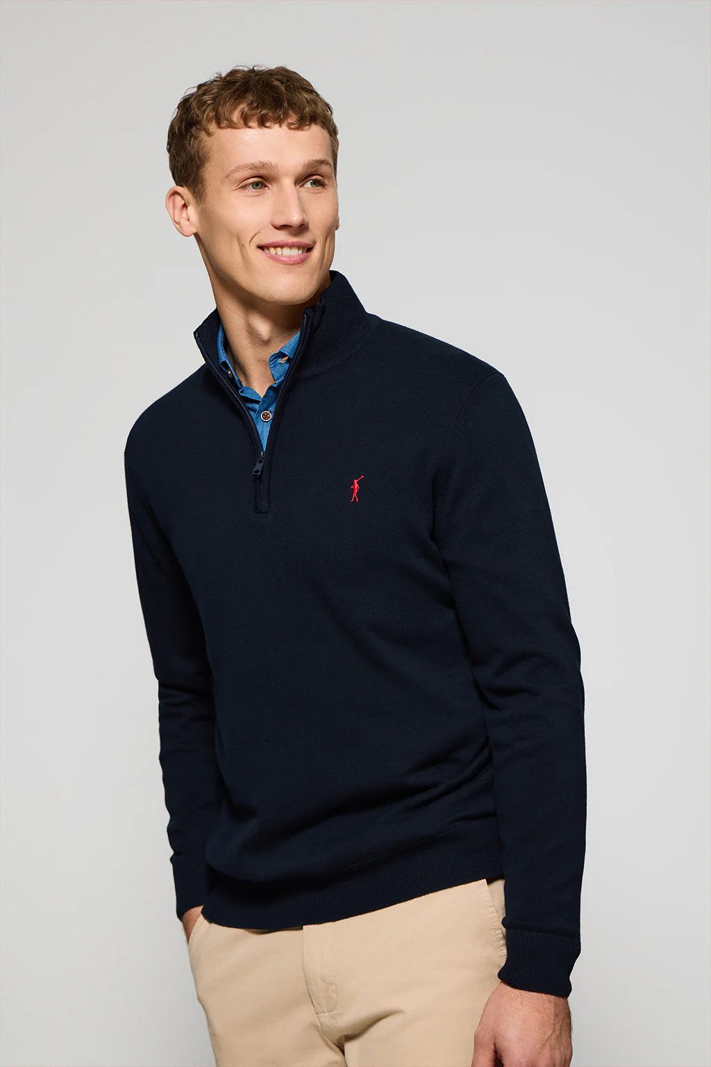 Navy-blue knit jumper with zip and Rigby Go embroidered logo