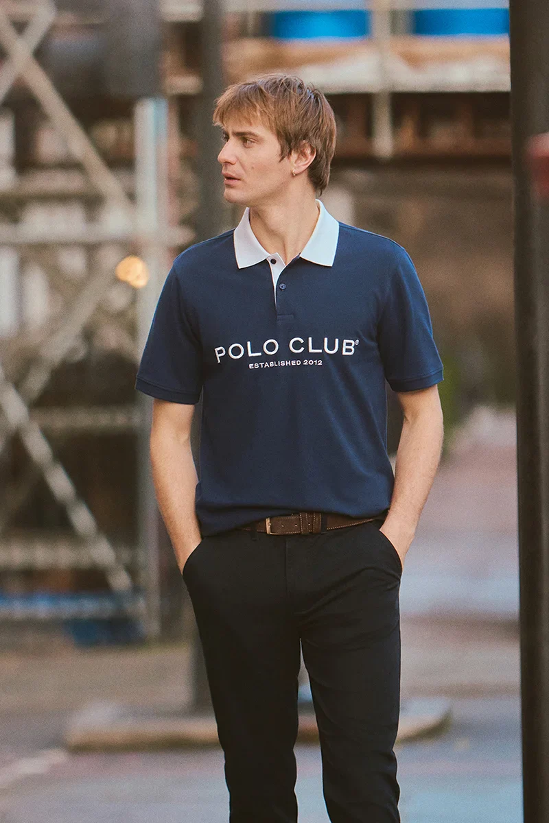 Navy-blue polo shirt with collar and Established 2012 Polo Club logo in contrasting colour