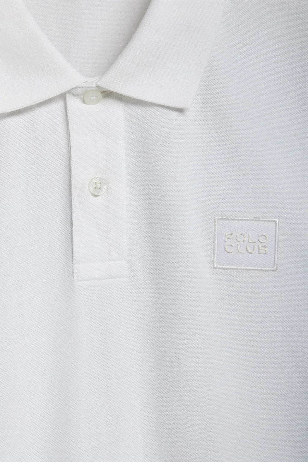 White two-button Portos polo shirt with Polo Club rubberised twill patch detail - Image 7