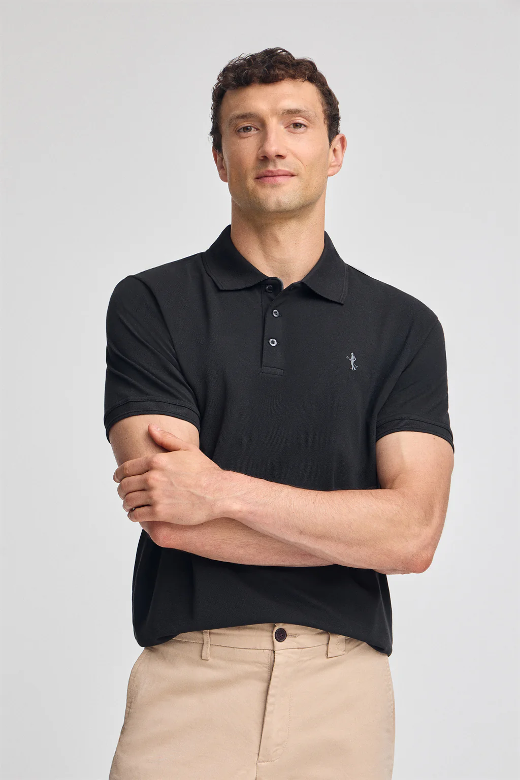 Black short-sleeve pique polo shirt with Rigby Best embroidery