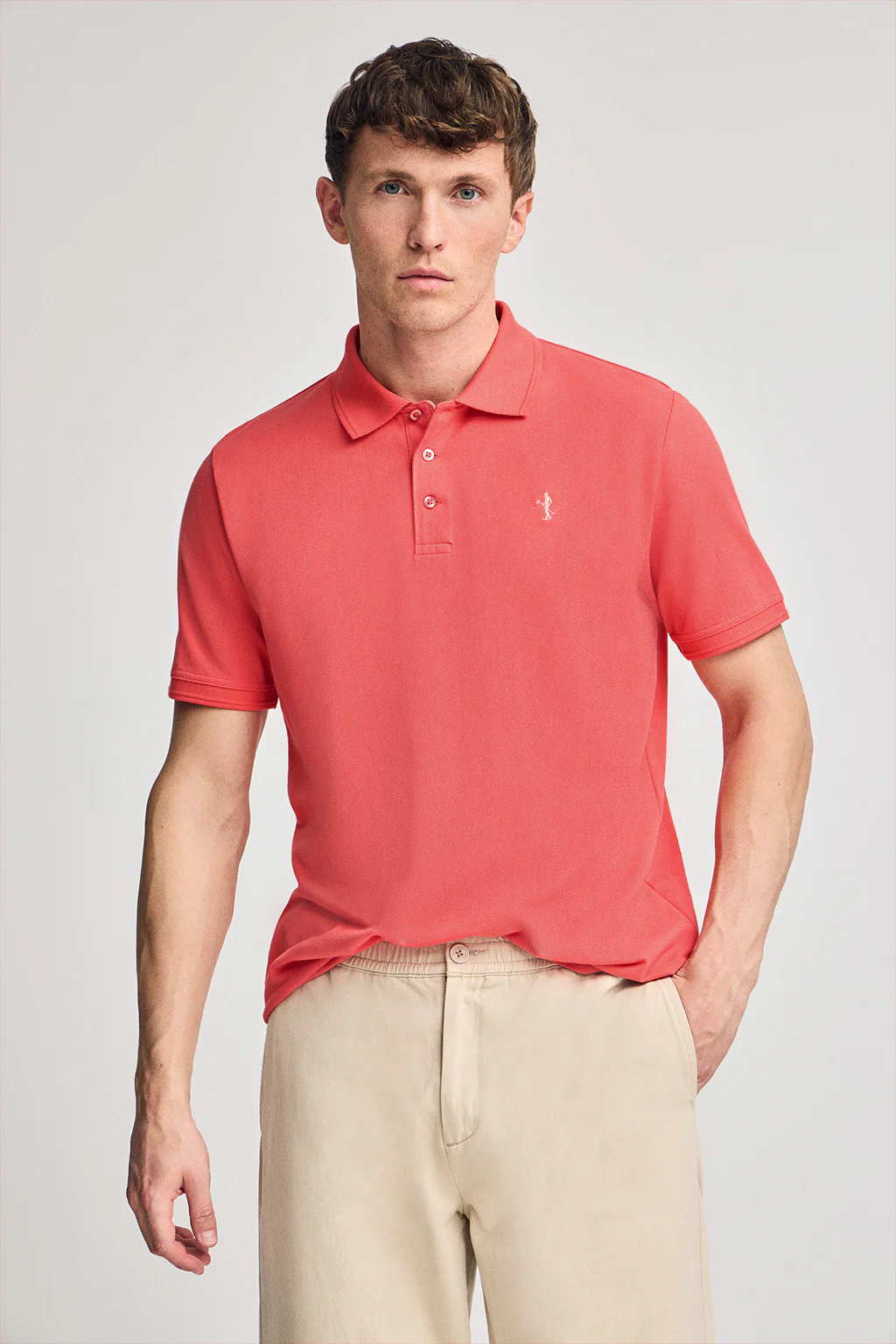 Coral short-sleeve pique polo shirt with Rigby Best embroidery