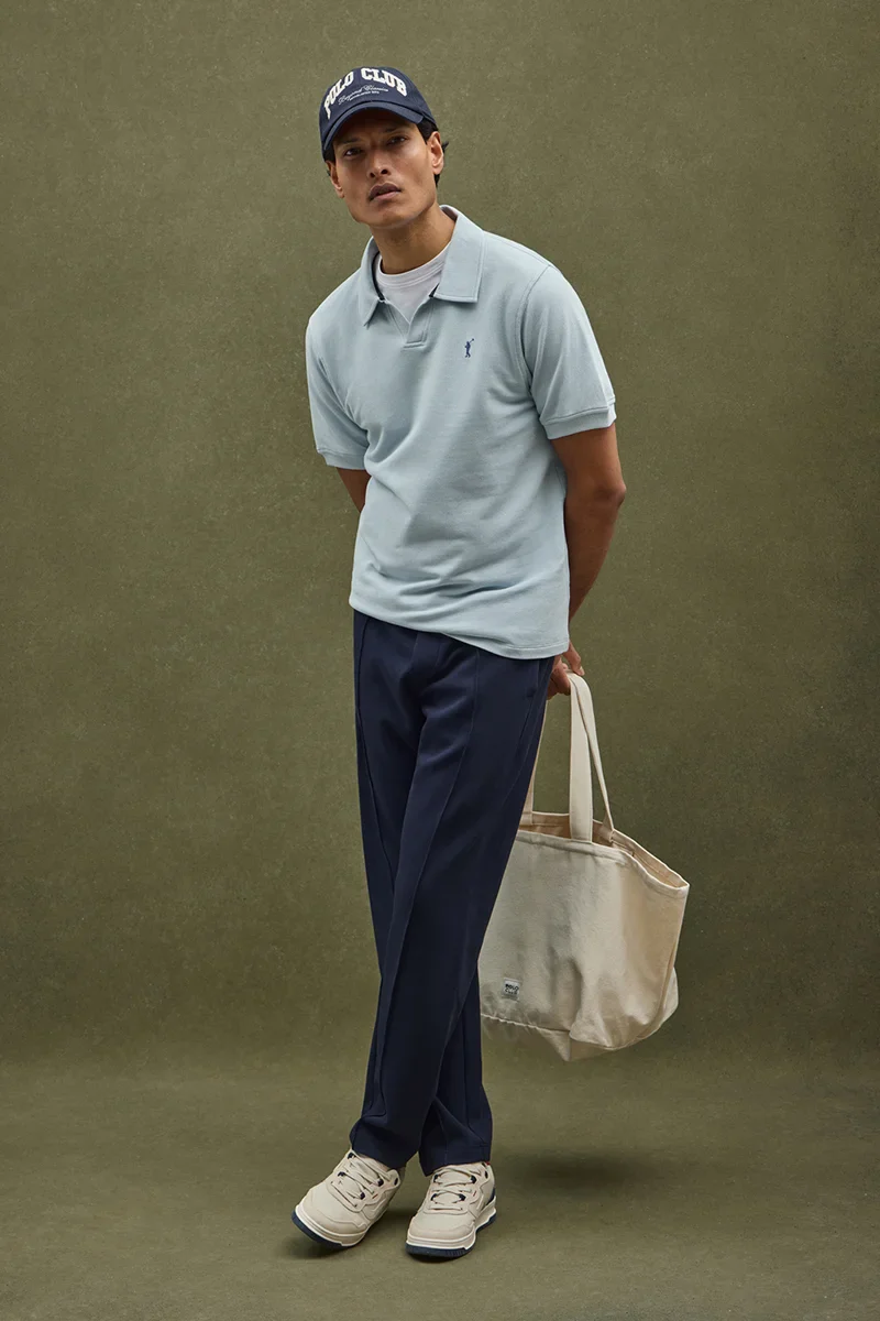 Light-blue micro-structured cotton polo shirt with Rigby Go embroidery
