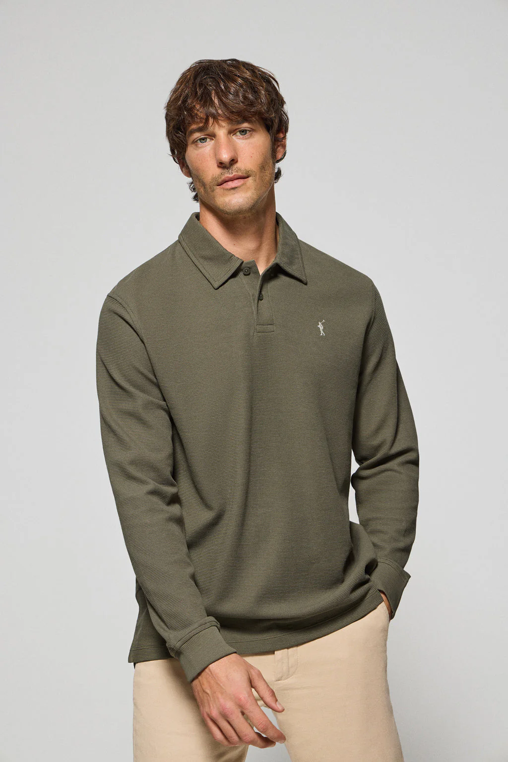 Army-green long-sleeve polo shirt with two buttons and Rigby Go logo