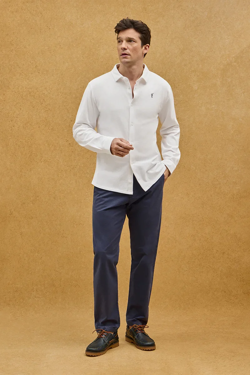 White full-button polo shirt with Rigby Go embroidery