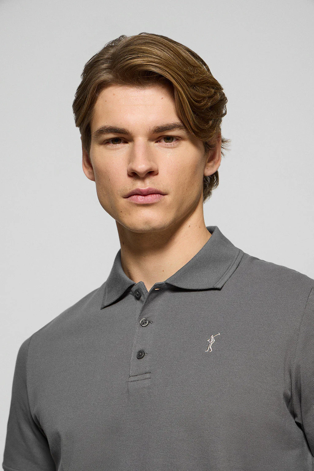 Asphalt-grey polo shirt with three buttons and Rigby Go embroidered logo