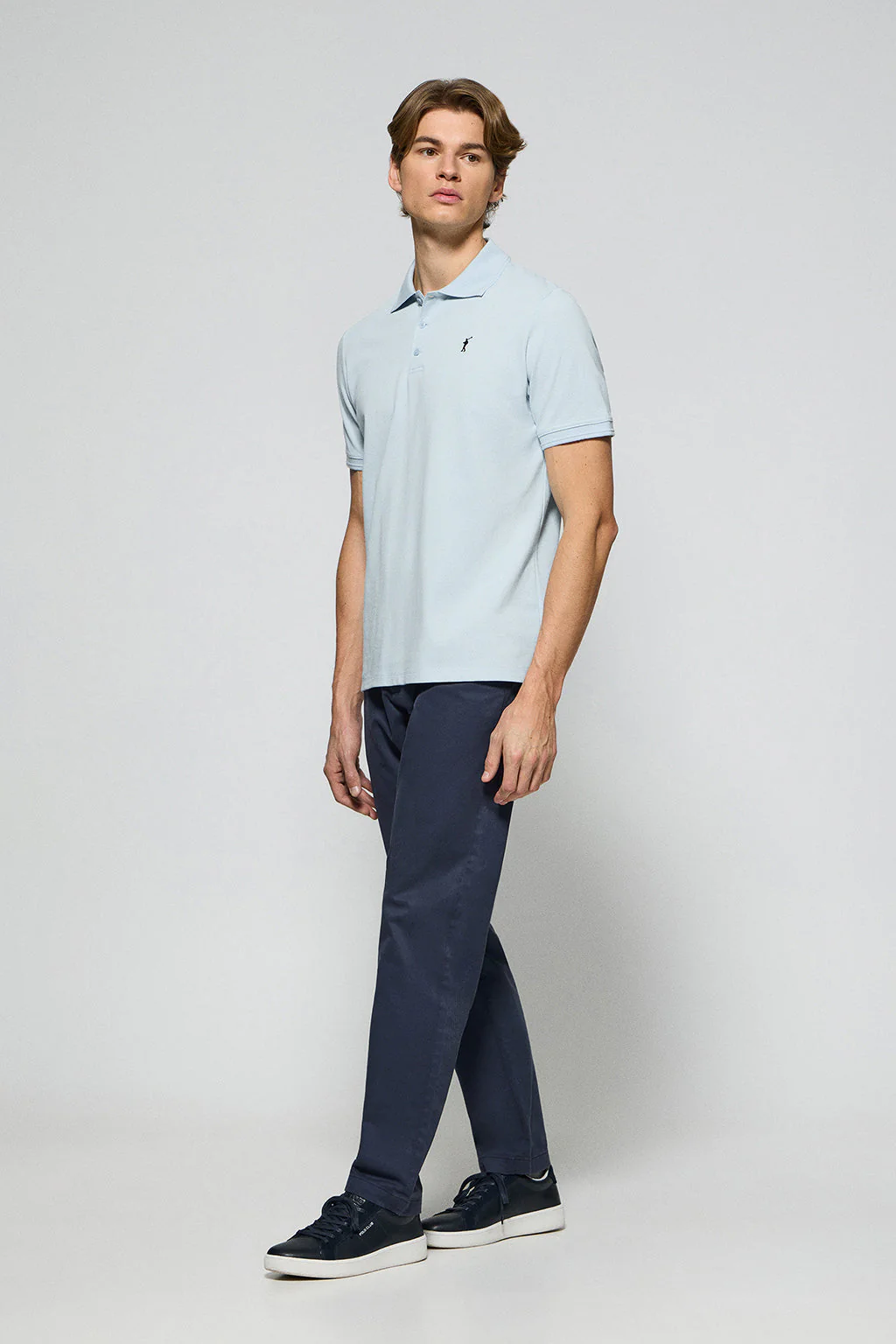 Light-blue polo shirt with three buttons and Rigby Go embroidered logo - Image 3