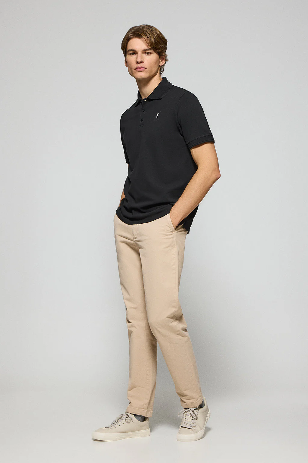 Black polo shirt with three buttons and Rigby Go embroidered logo - Image 3