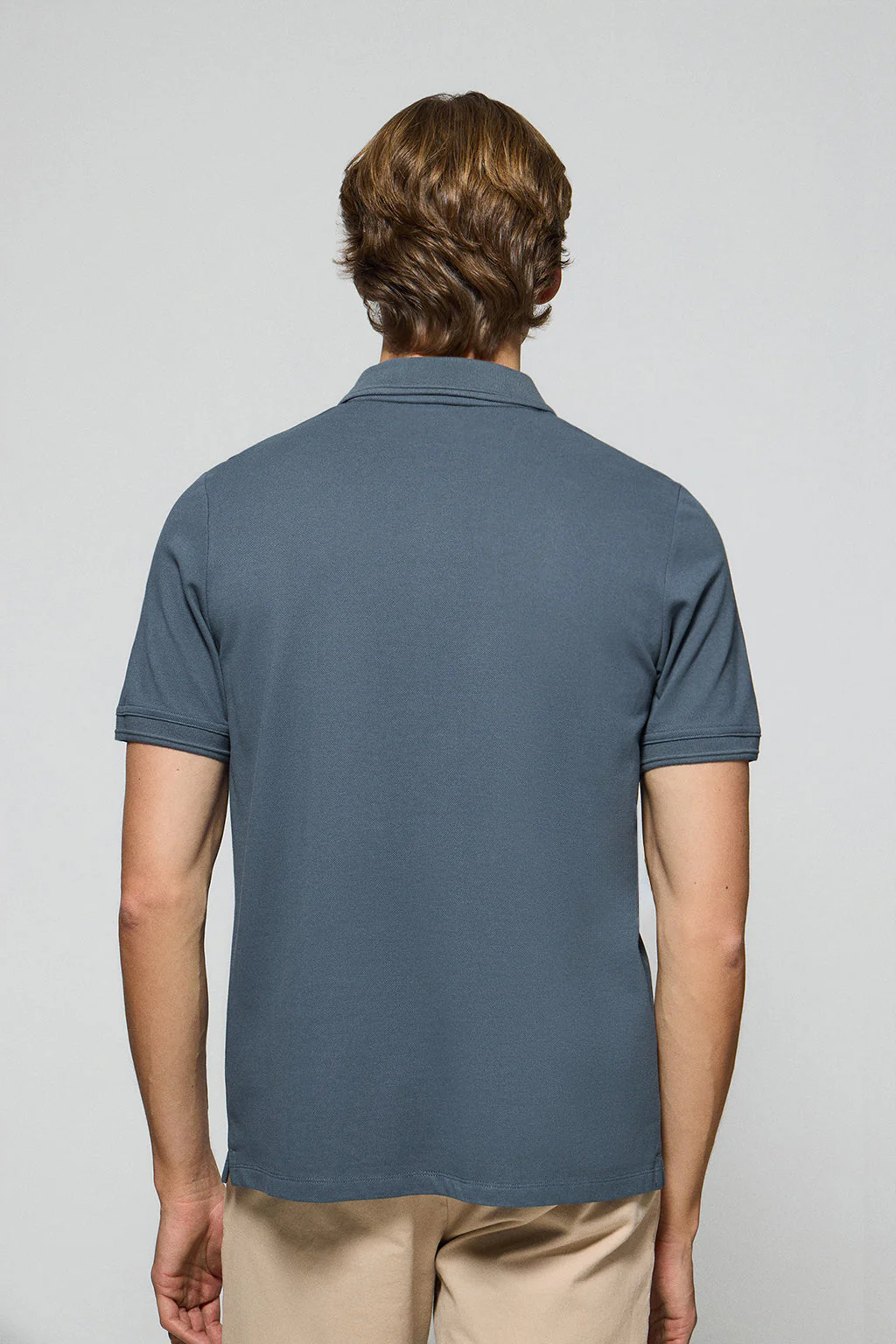 Denim-blue polo shirt with three buttons and Rigby Go embroidered logo - Image 4