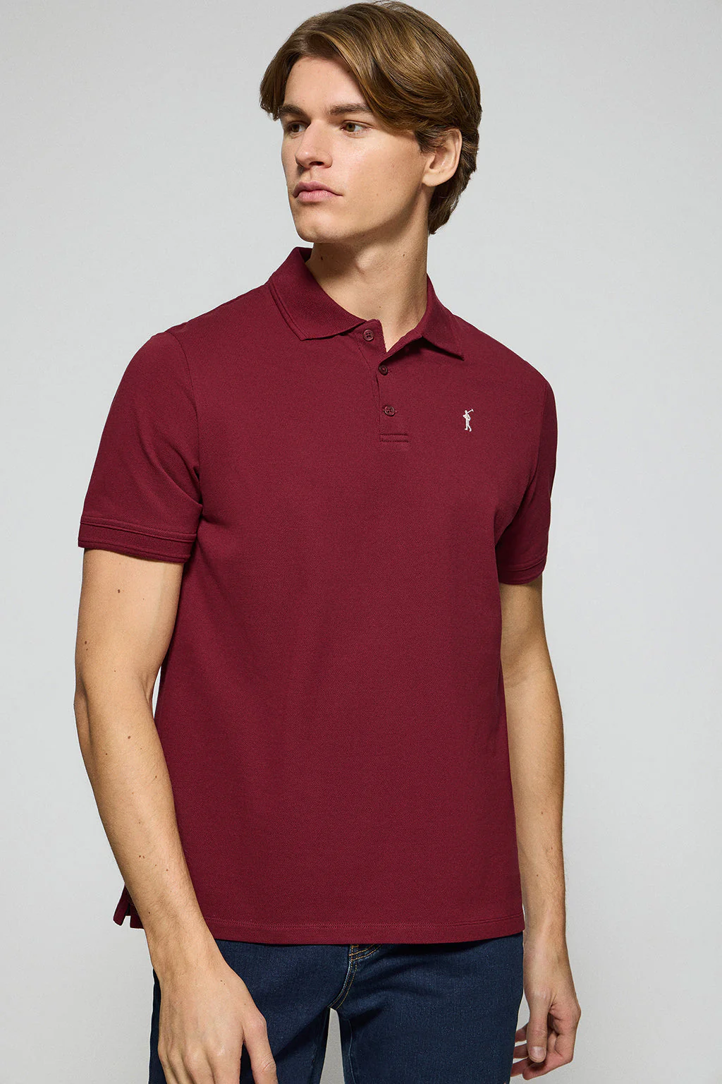 Maroon polo shirt with three buttons and Rigby Go embroidered logo