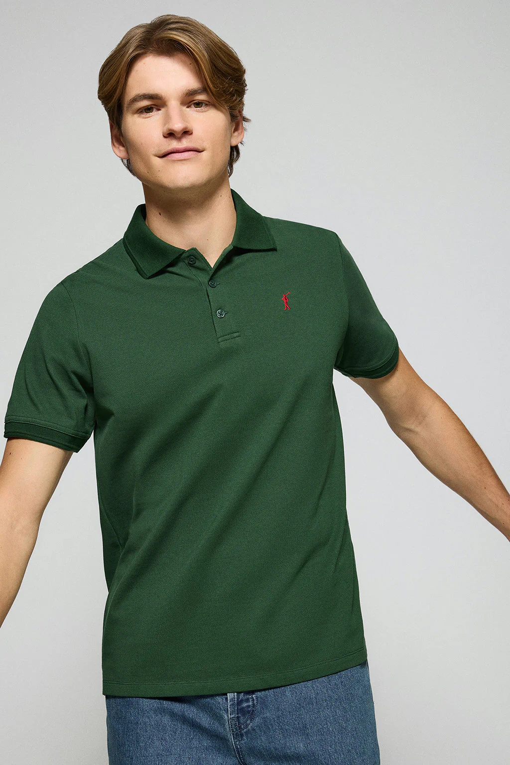 Bottle-green polo shirt with three buttons and Rigby Go embroidered logo