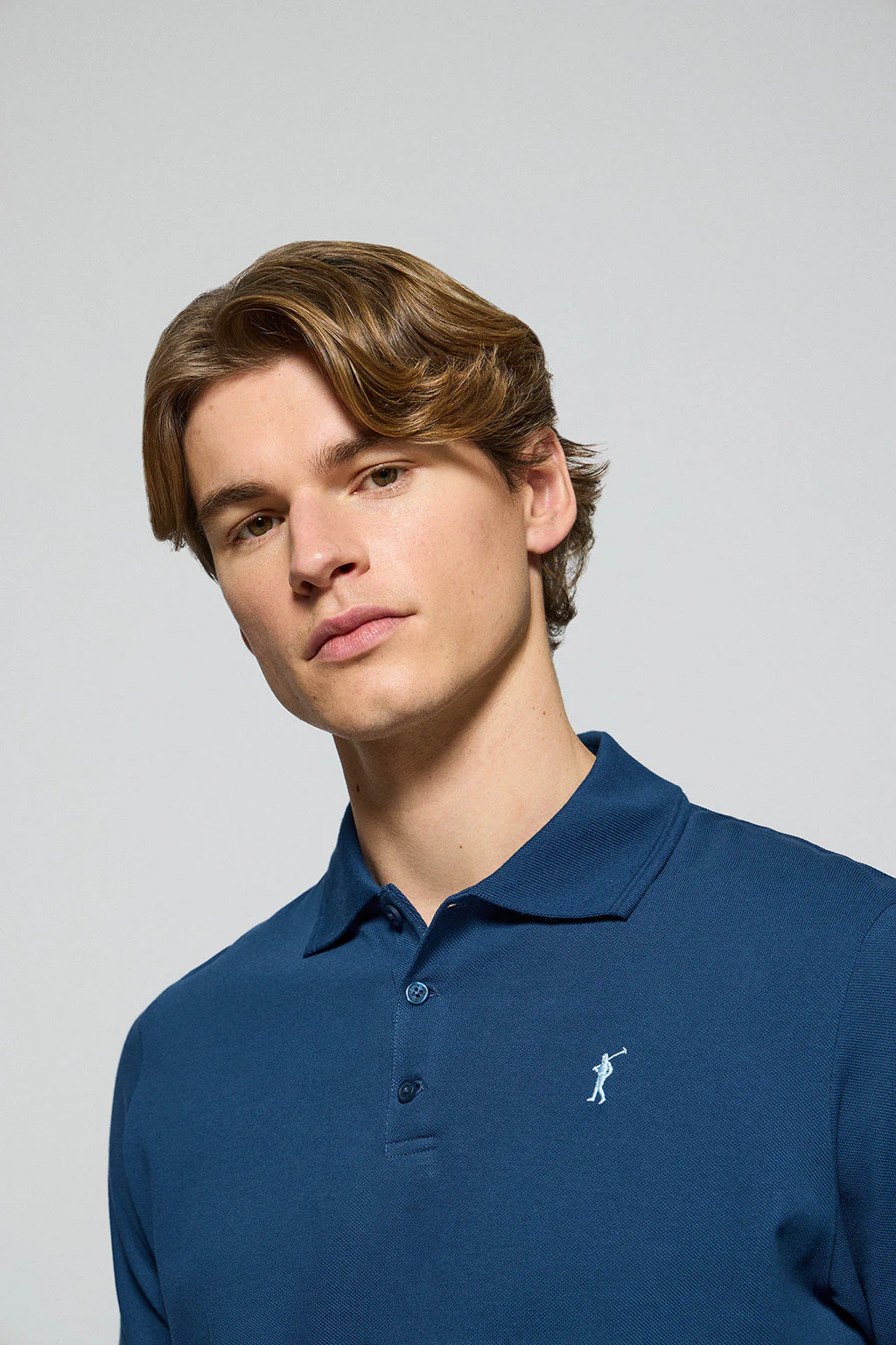 Indigo-blue polo shirt with three buttons and Rigby Go embroidered logo - Image 2