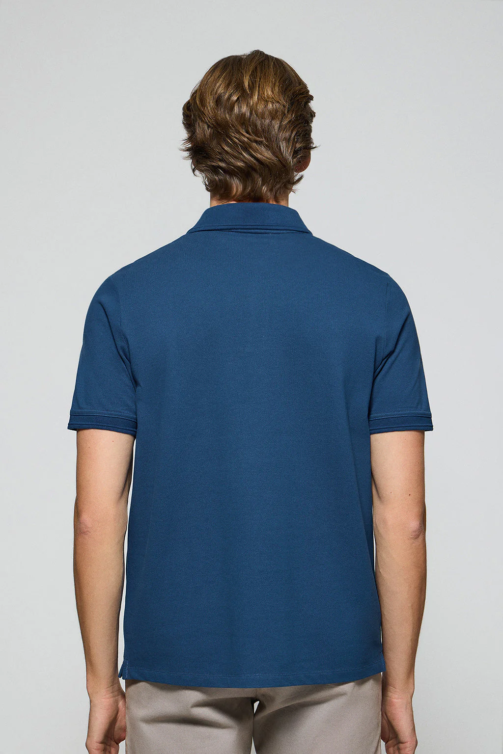 Indigo-blue polo shirt with three buttons and Rigby Go embroidered logo - Image 4