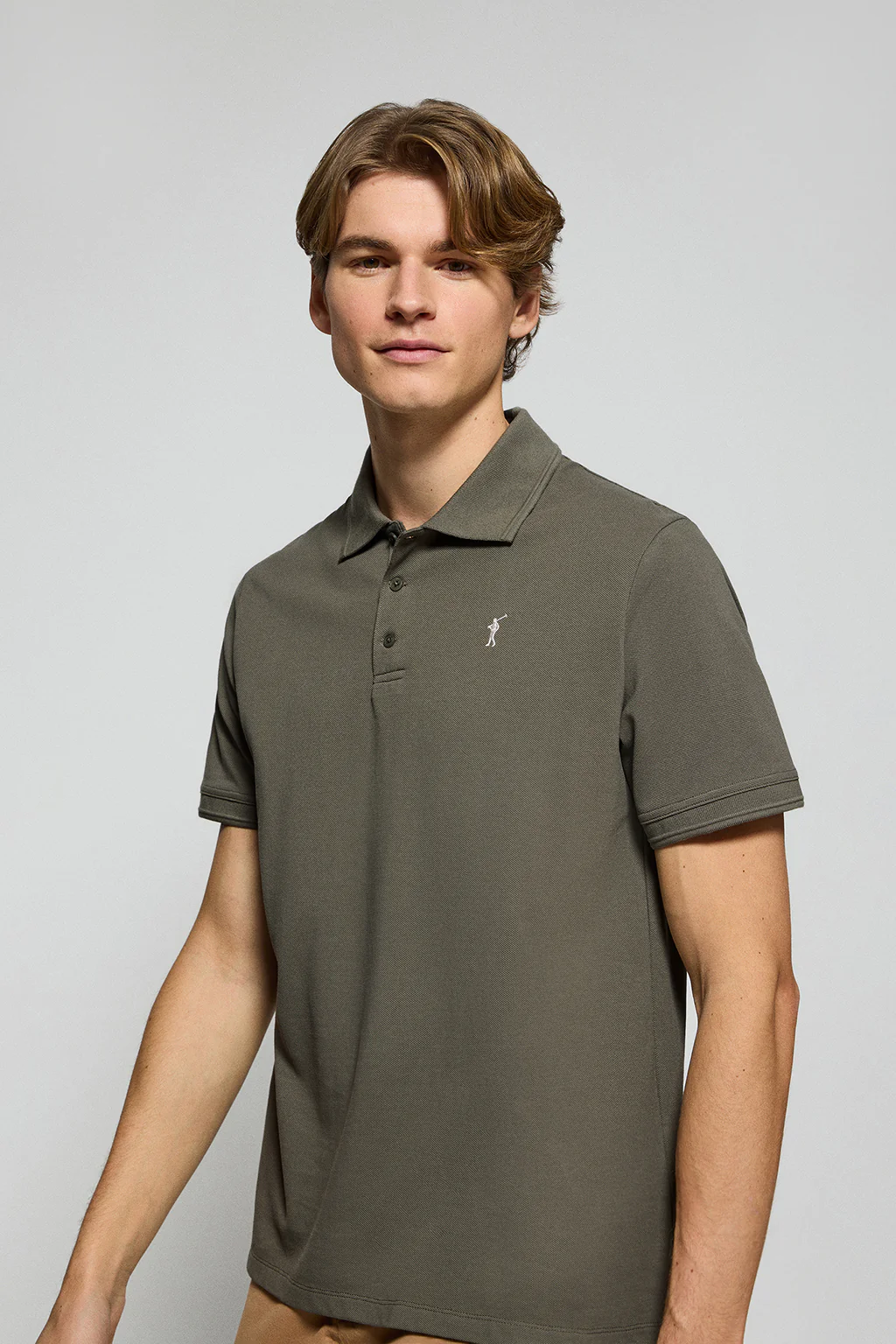Army-green polo shirt with three buttons and Rigby Go embroidered logo