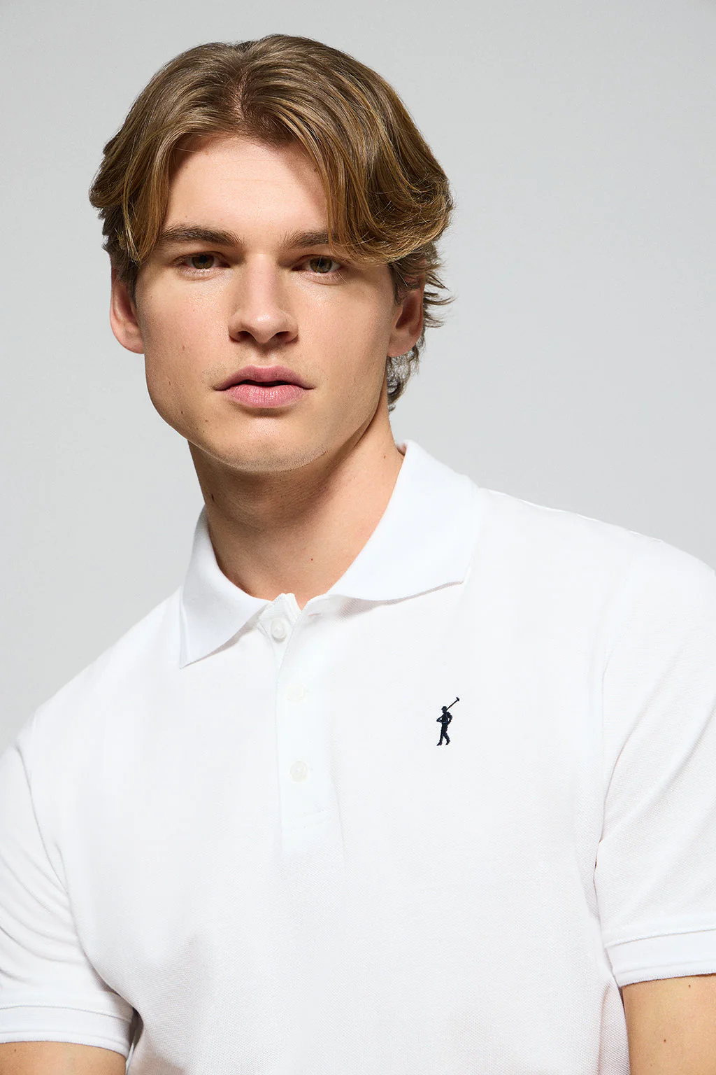 White polo shirt with three buttons and Rigby Go embroidered logo - Image 2