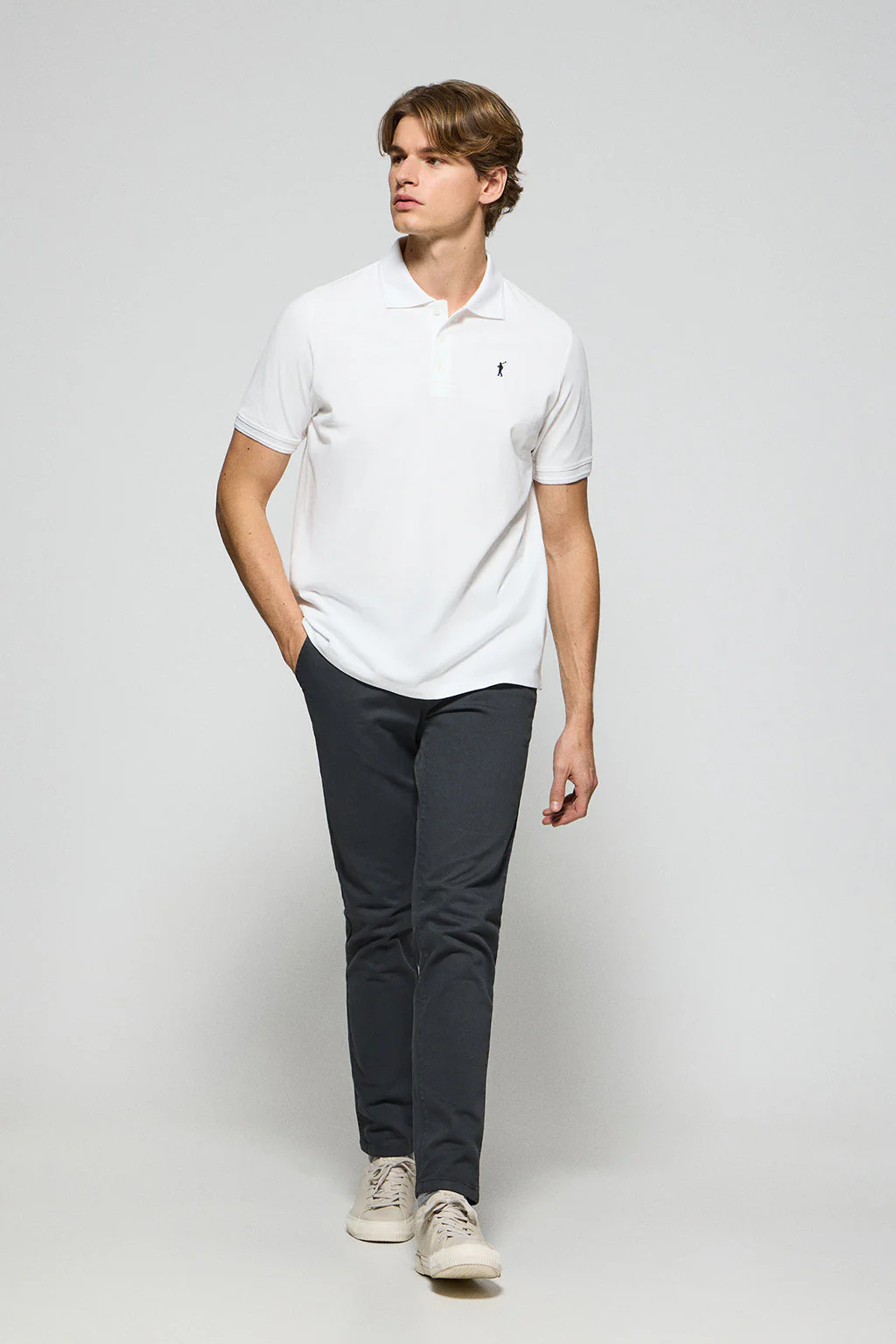 White polo shirt with three buttons and Rigby Go embroidered logo - Image 3