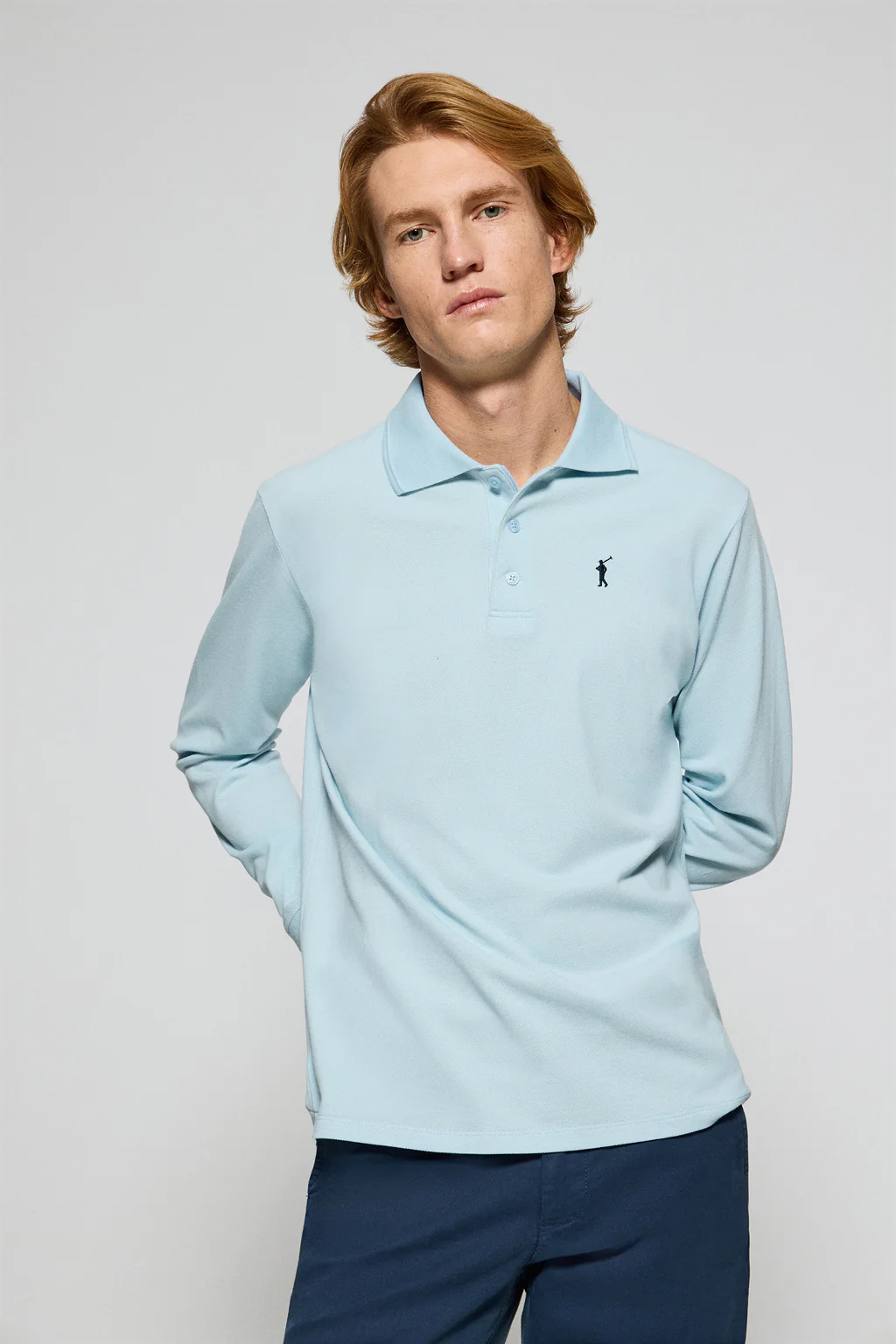 Light-blue long-sleeve polo shirt with three buttons and Rigby Go logo