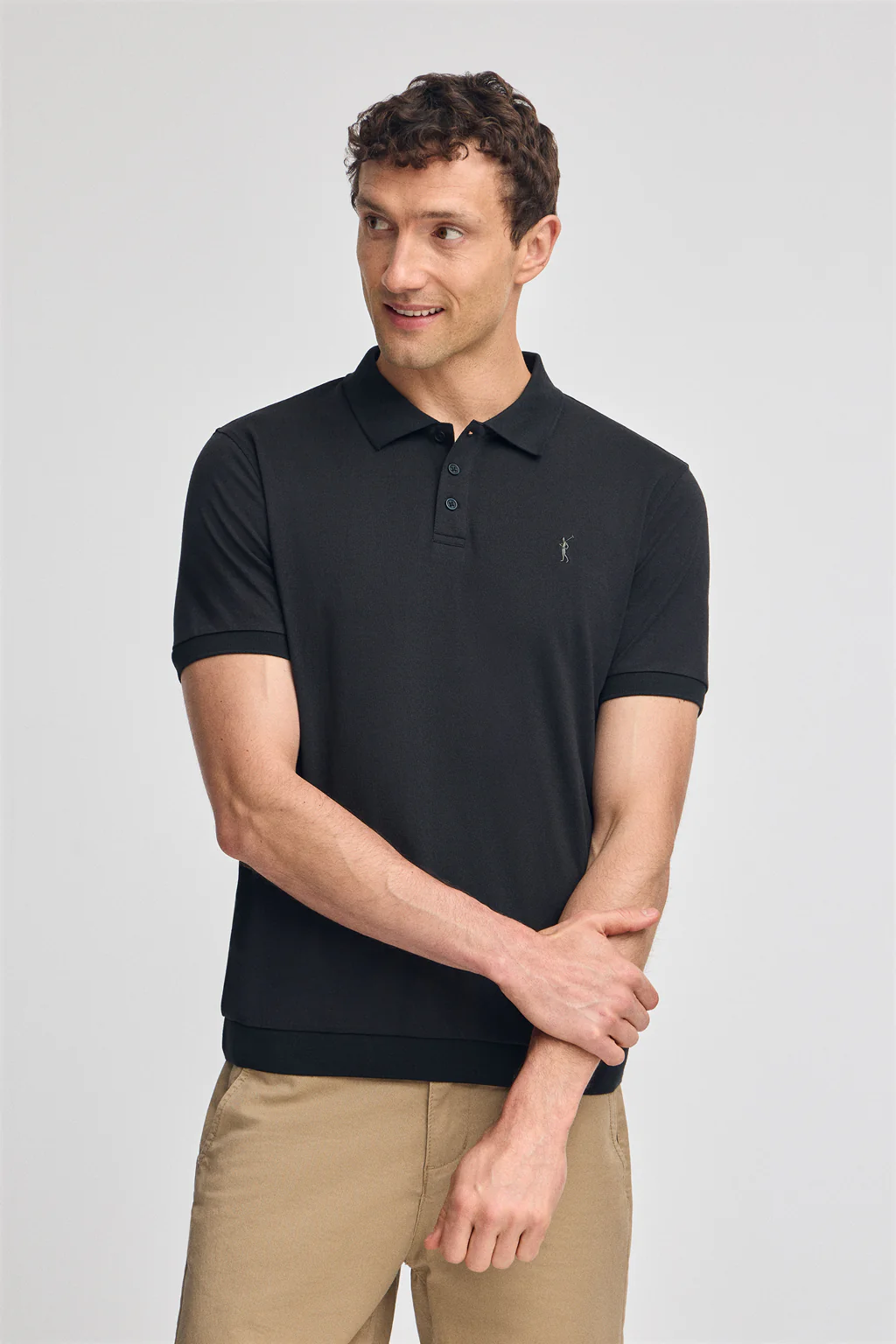 Black polo shirt with Rigby Go embroidery