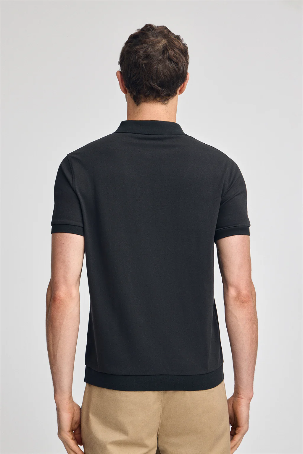Black polo shirt with Rigby Go embroidery - Image 2