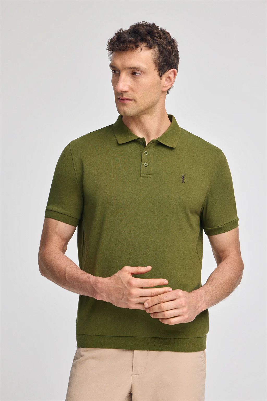 Green polo shirt with Rigby Go embroidery