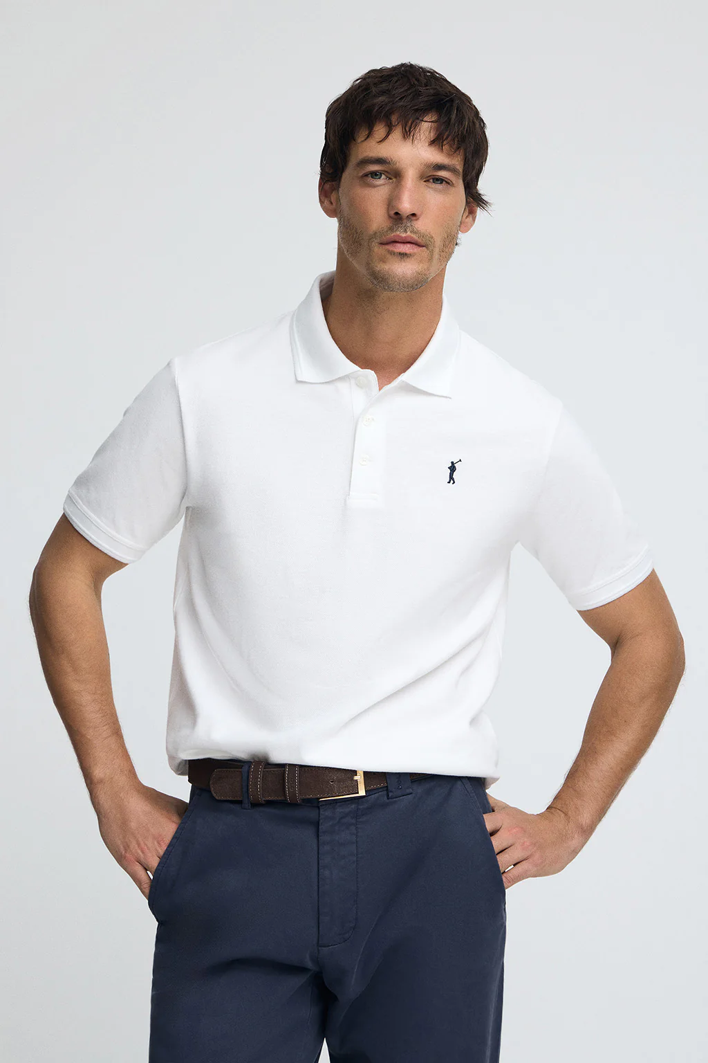White pique polo shirt with Rigby Go embroidered logo