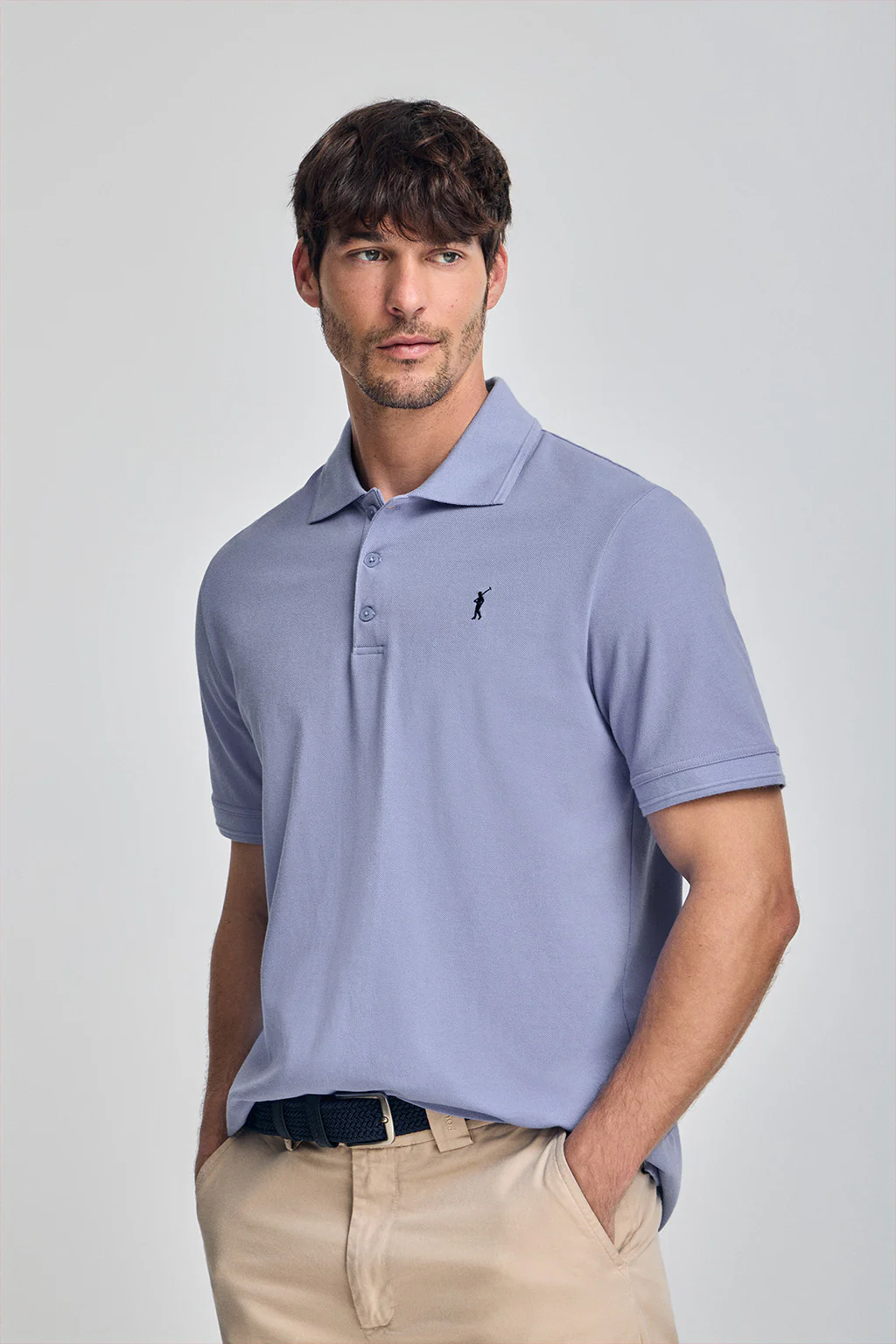 Aqua short-sleeve polo shirt with three buttons and Rigby Go embroidered logo