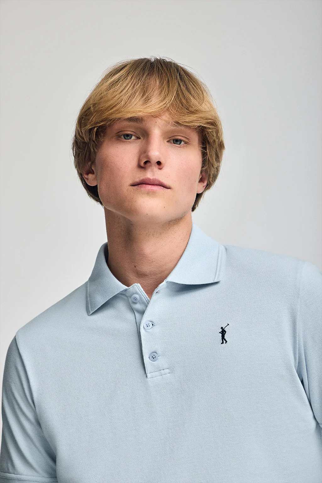 Light-blue short-sleeve polo shirt with three buttons and Rigby Go embroidered logo - Image 3