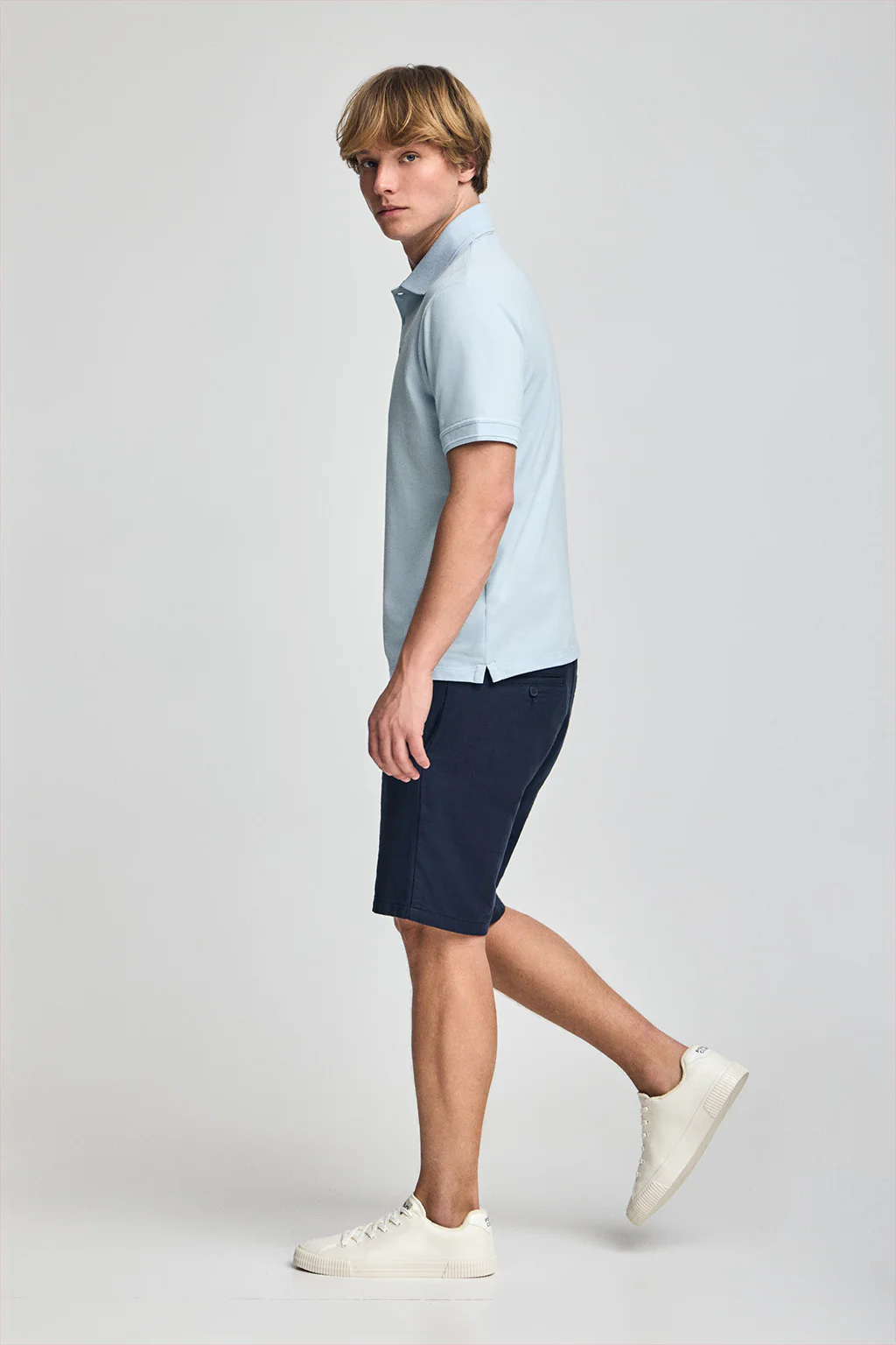 Light-blue short-sleeve polo shirt with three buttons and Rigby Go embroidered logo - Image 4