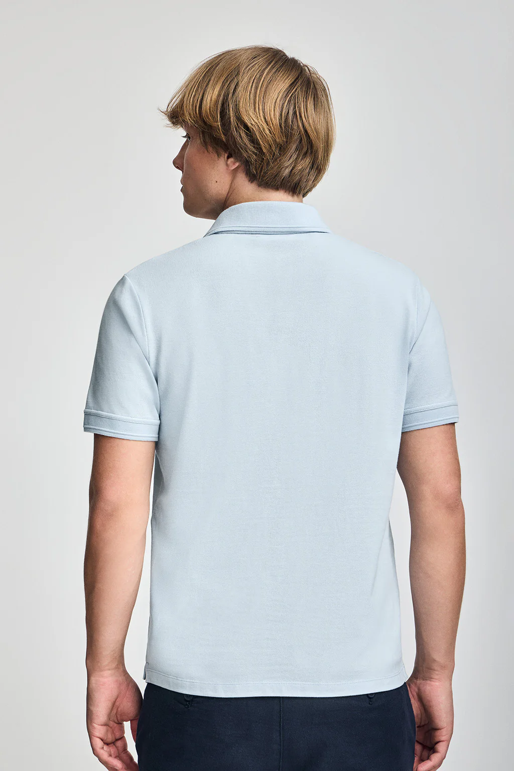 Light-blue short-sleeve polo shirt with three buttons and Rigby Go embroidered logo - Image 5