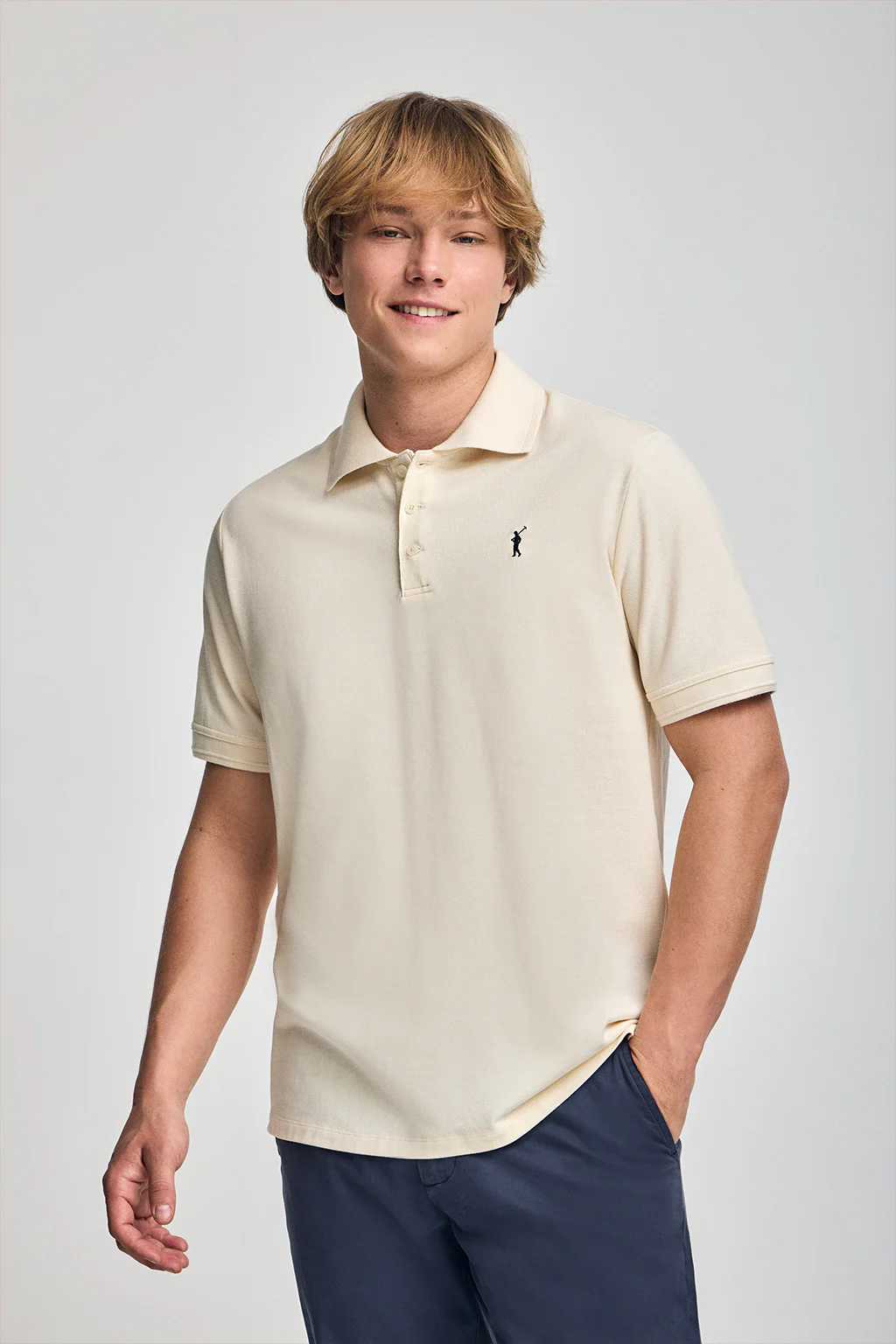 Nude short-sleeve polo shirt with three buttons and Rigby Go embroidered logo
