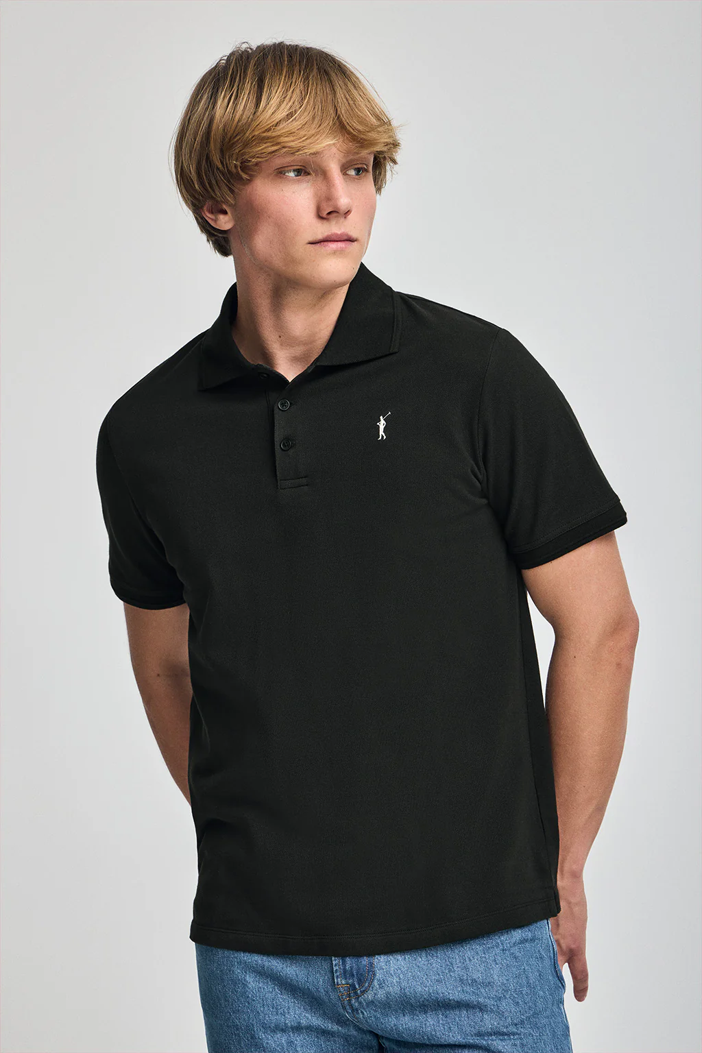 Black short-sleeve polo shirt with three buttons and Rigby Go embroidered logo