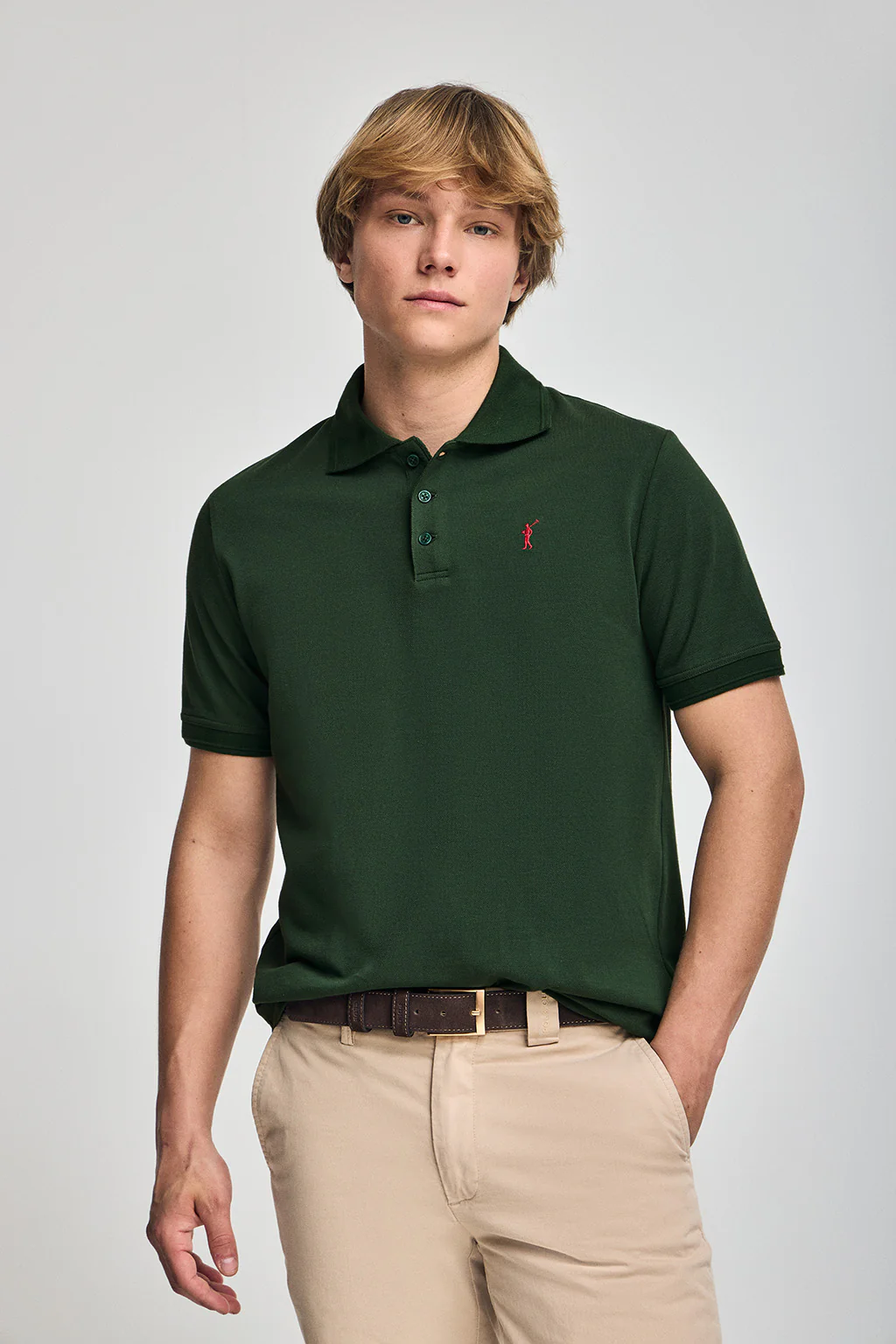 Bottle-green short-sleeve polo shirt with three buttons and Rigby Go embroidered logo