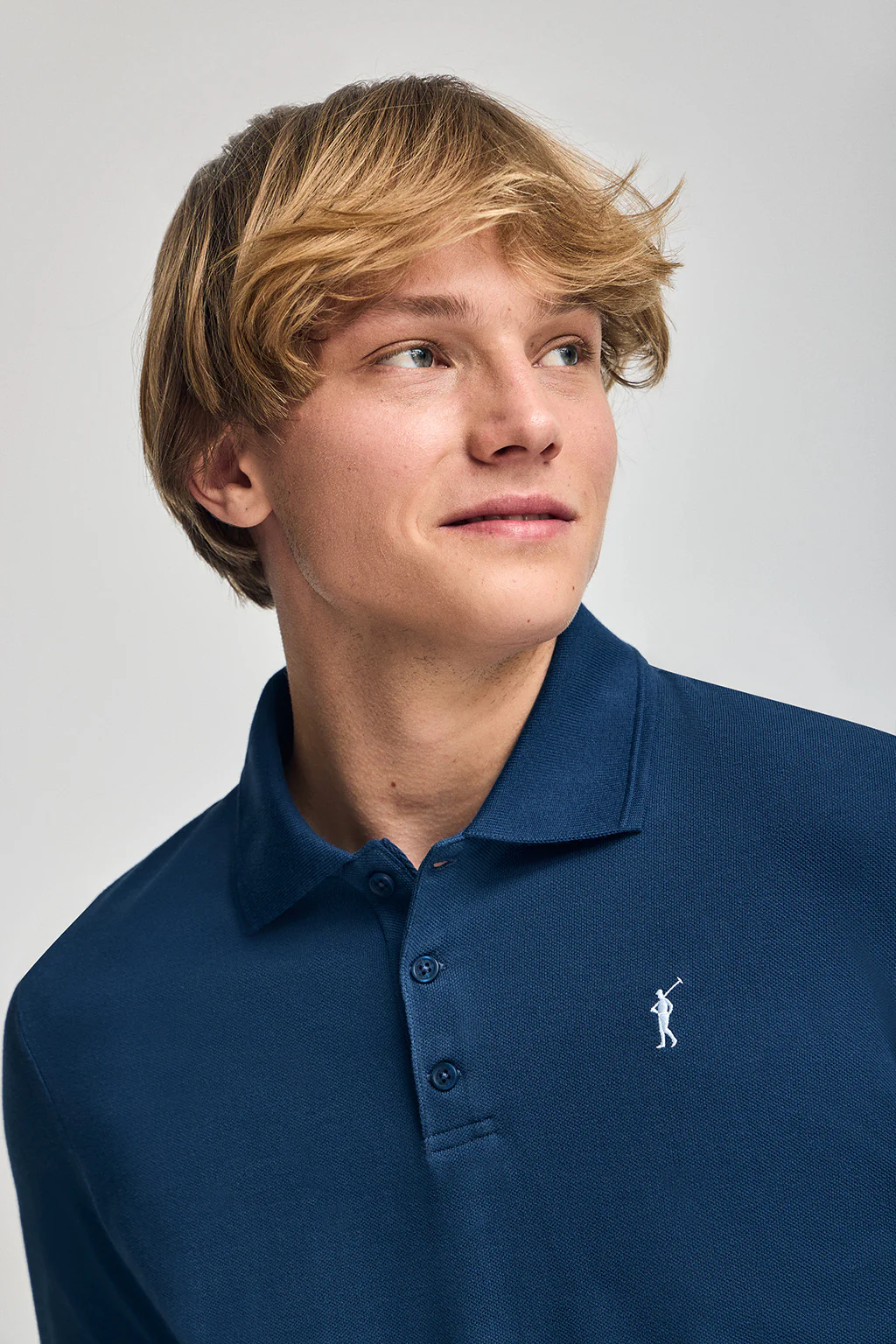 Indigo-blue short-sleeve polo shirt with three buttons and Rigby Go embroidered logo - Image 3