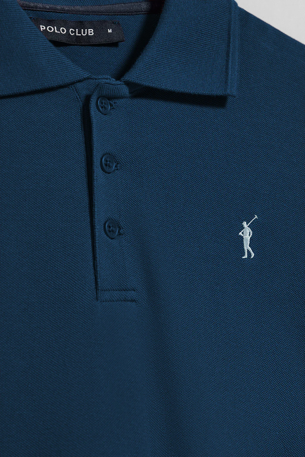 Indigo-blue short-sleeve polo shirt with three buttons and Rigby Go embroidered logo - Image 8