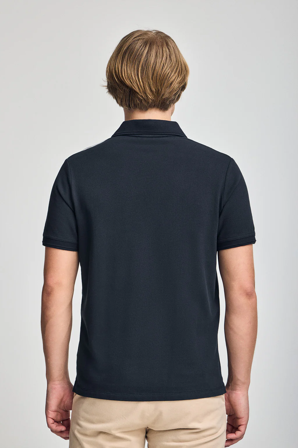 Navy-blue short-sleeve polo shirt with three buttons and Rigby Go embroidered logo - Image 3
