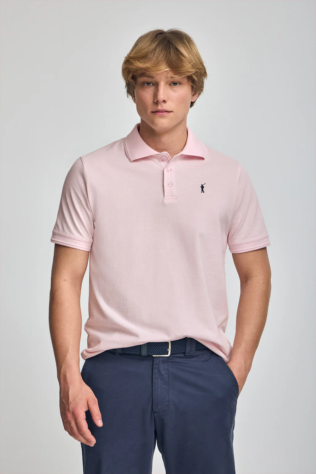 Pink short-sleeve polo shirt with three buttons and Rigby Go embroidered logo