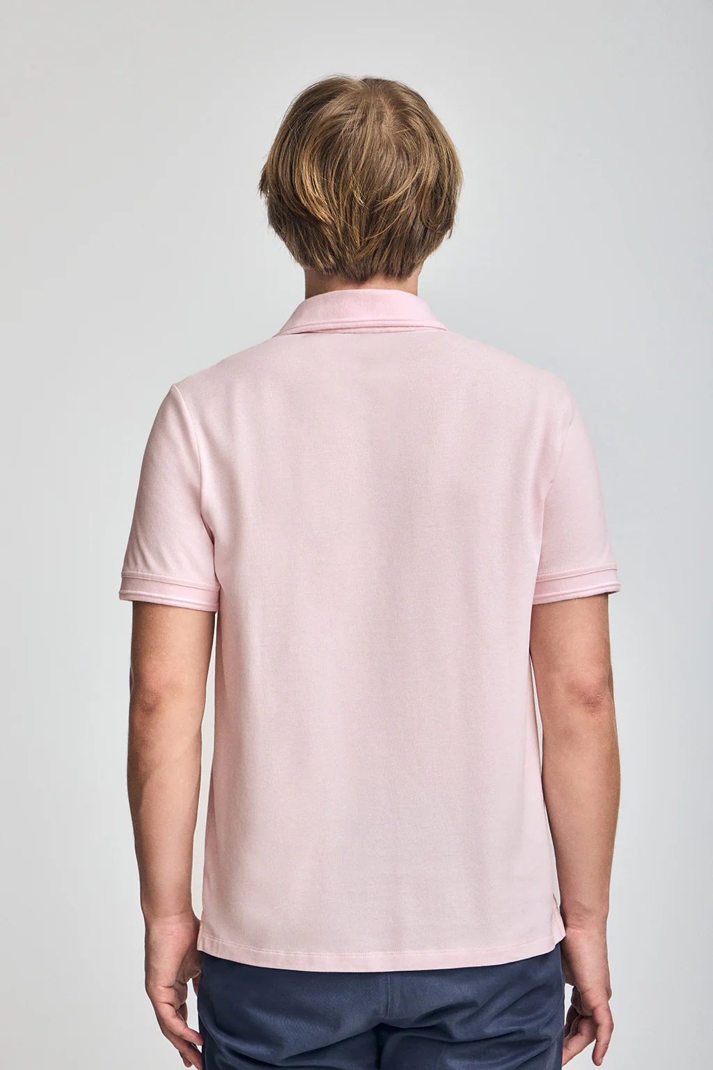 Pink short-sleeve polo shirt with three buttons and Rigby Go embroidered logo - Image 2