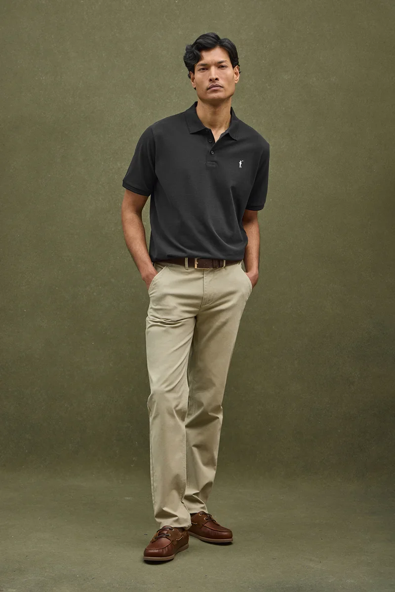 Black short-sleeve polo shirt with Rigby Go embroidered logo