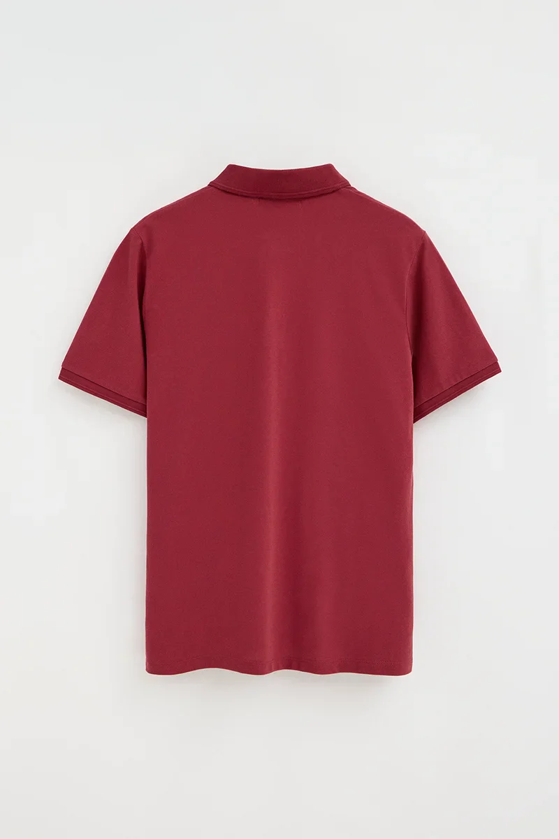 Burnt-red short-sleeve polo shirt with Rigby Go embroidered logo - Image 7