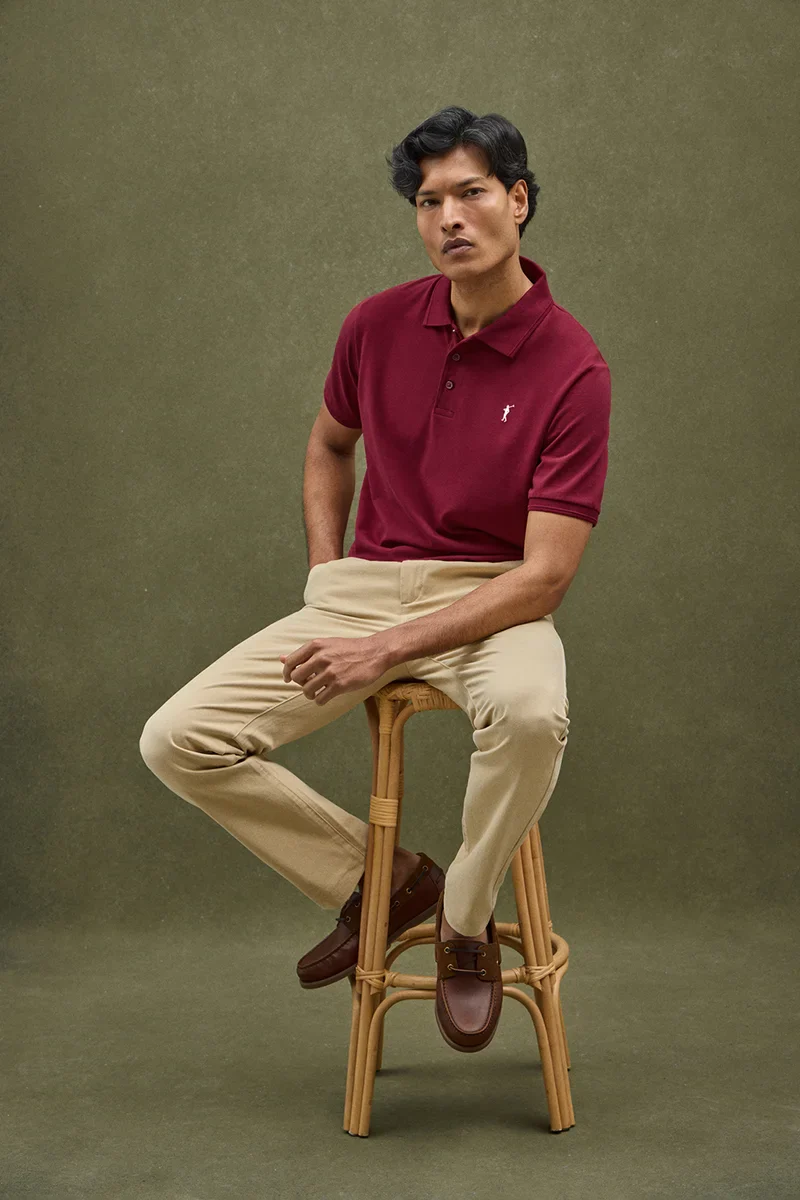 Maroon short-sleeve polo shirt with Rigby Go embroidered logo