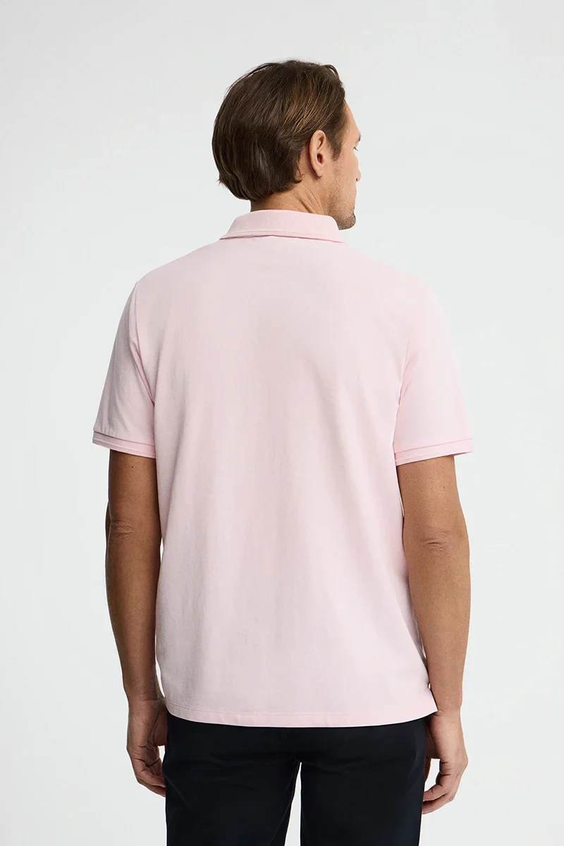 Pink short-sleeve polo shirt with Rigby Go embroidered logo - Image 5