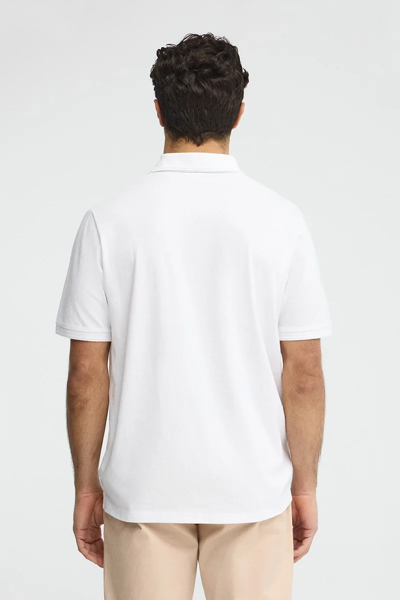 White short-sleeve polo shirt with Rigby Go embroidered logo - Image 5